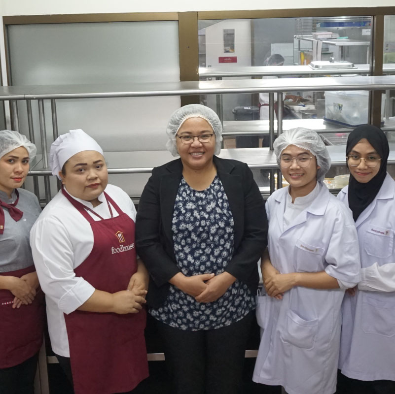 female kitchen staffs are ready to serve every customers with our best catering service - foodhouse